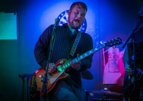 East On Division guitarist